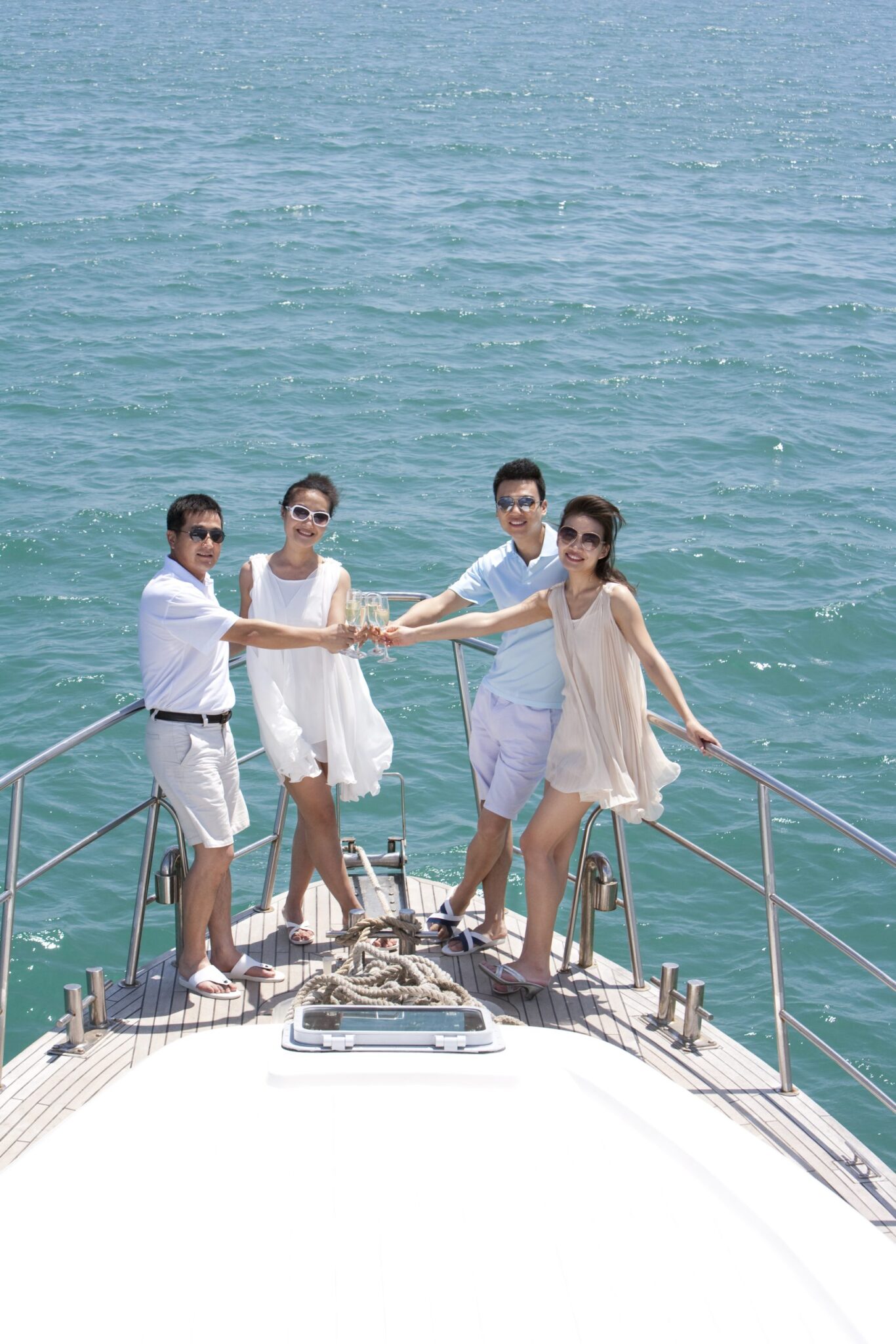 Intimate Wedding Yacht Rentals Miami | Miami Boat Charters Wedding yachts in Miami for an intimate affair — bride and groom on deck of private charter yacht at golden hour on Biscayne Bay